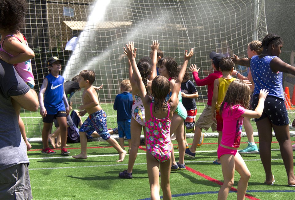  Kick off your flip-flops and enjoy free outdoor play in the high-powered sprinklers at Asphalt Green's Sprinkler Day. Photo courtesy of Asphalt Green