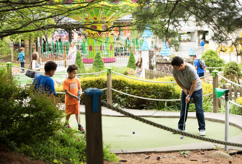 Enjoy some quality family time at the Castle Fun Center's mini-golf course.