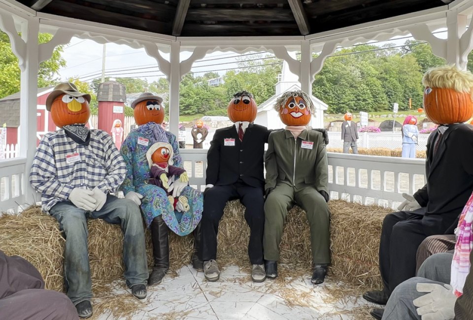Image of pumpkin-people gathered in a gazebo at Pumpkintown USA.