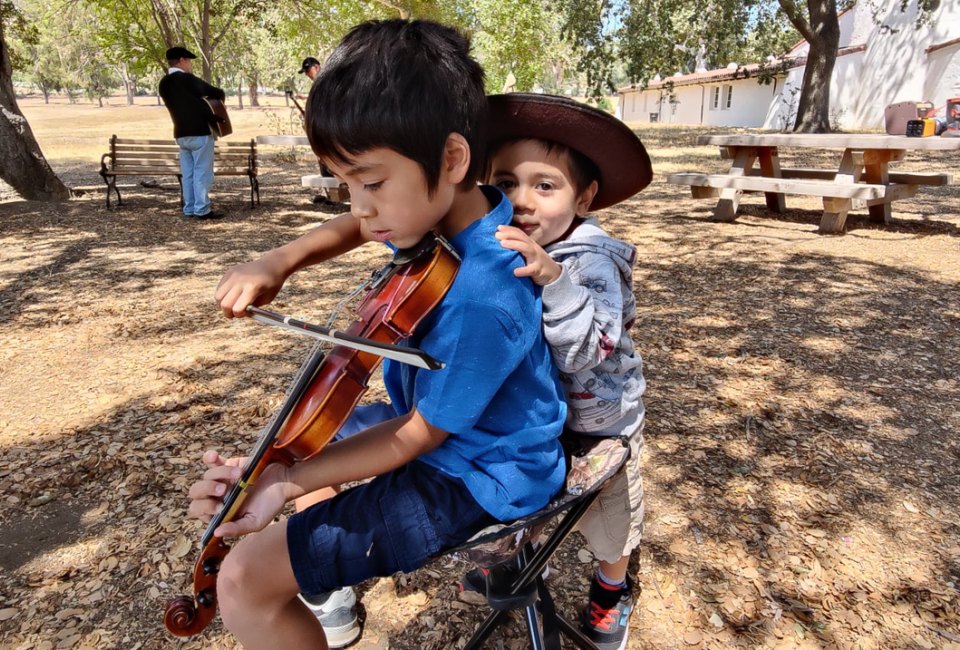 Play the fiddle and step over to the dance barn. Photo courtesy of the Topanga Banjo Fiddle Contest and Folk Festival