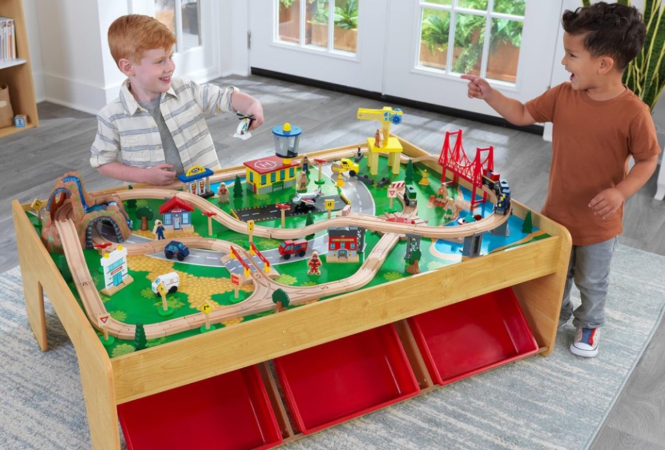 The KidKraft Wooden Train Set & Table is hours of creative fun that grows with your kids.