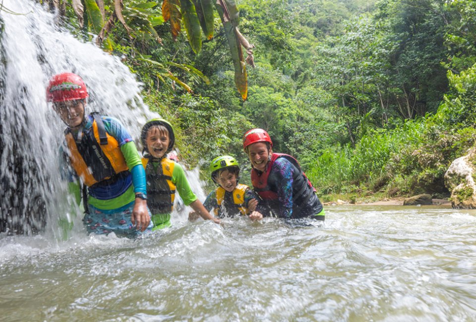 Puerto Rico with Kids: A 5-Day Itinerary for Off the Beaten Path Adventures Explore cave systems of Puerto Rico while swimming and floating in turquoise fresh water. Photo courtesy of Discover Puerto Rico