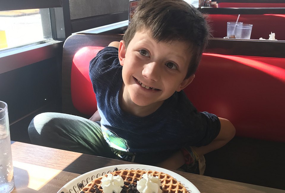 child eating at restaurant Exciting Things to Do on Christmas Day in Atlanta