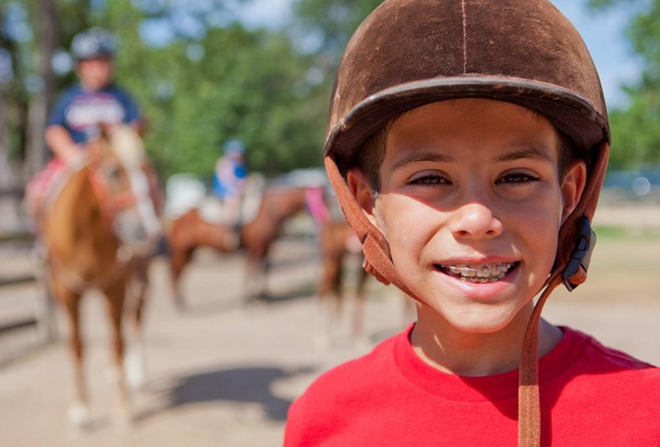 Horseback riding is a favorite kid activity in Conroe